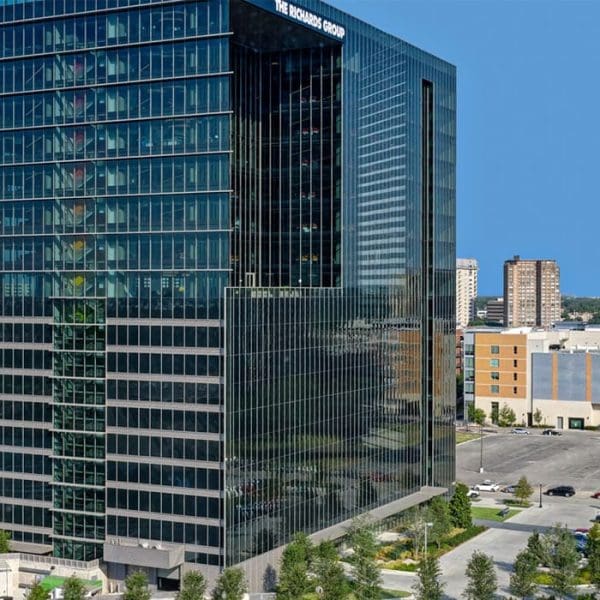 Daytime exterior view of The Richards Group headquarters in Dallas, showcasing the complex 4-sided structural glazed curtainwall system engineered by Childress Engineering